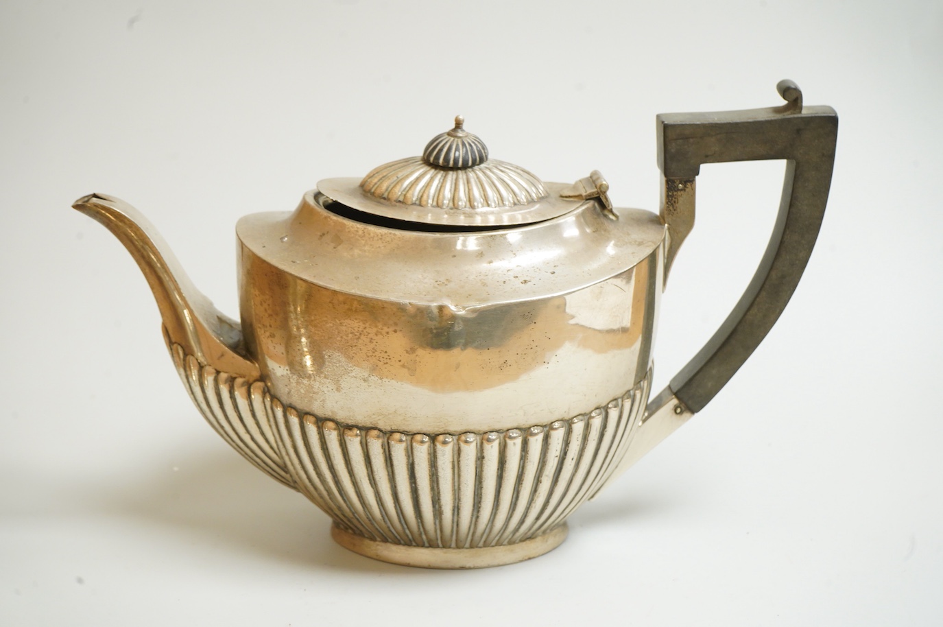 A George V demi-fluted silver oval teapot, Birmingham, 1918 and a 1970's silver vase by Mappin & Webb, gross weight 30.3oz.